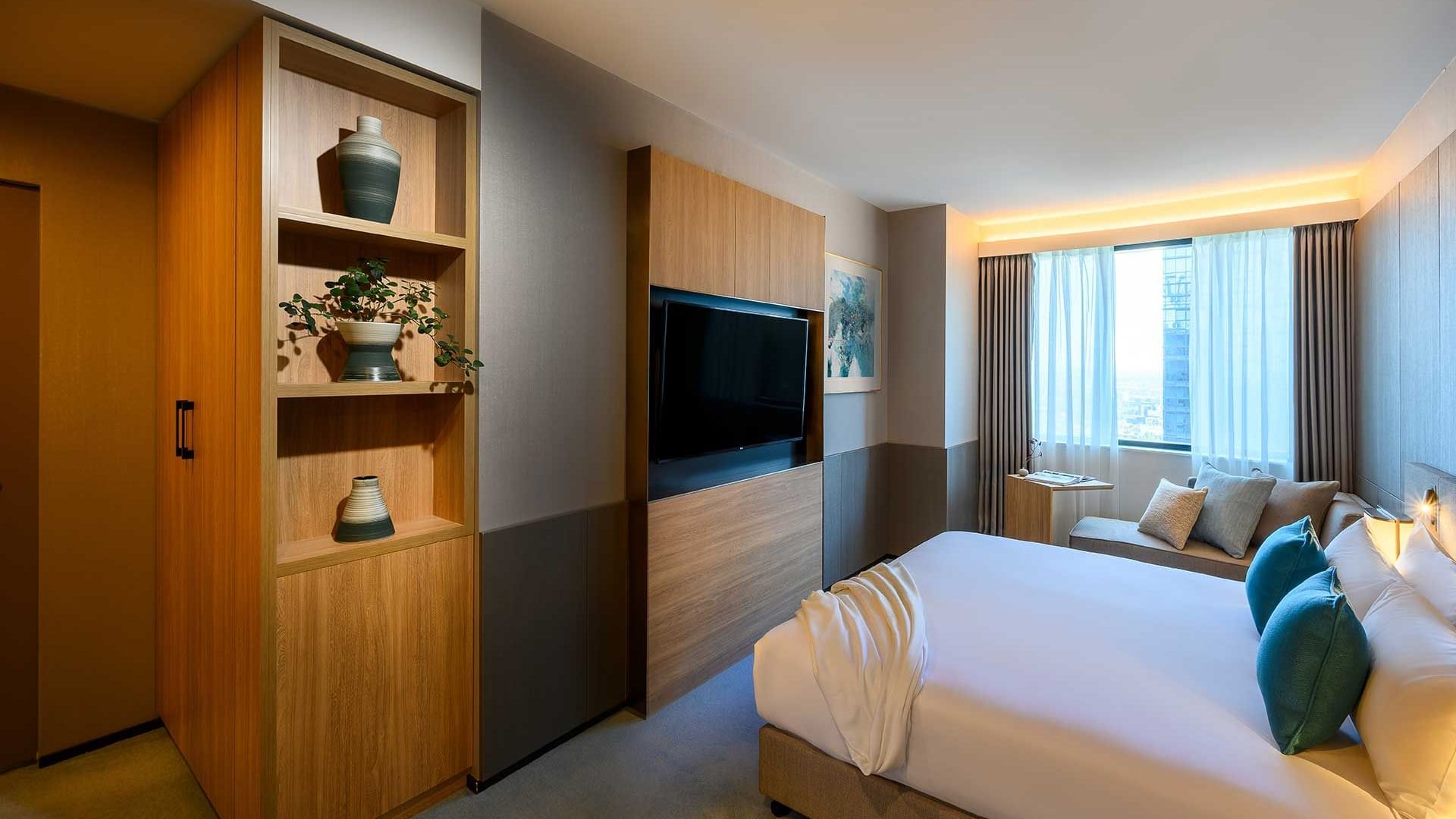 Double bed, TV in Junior Suite at Melbourne Central Hotels