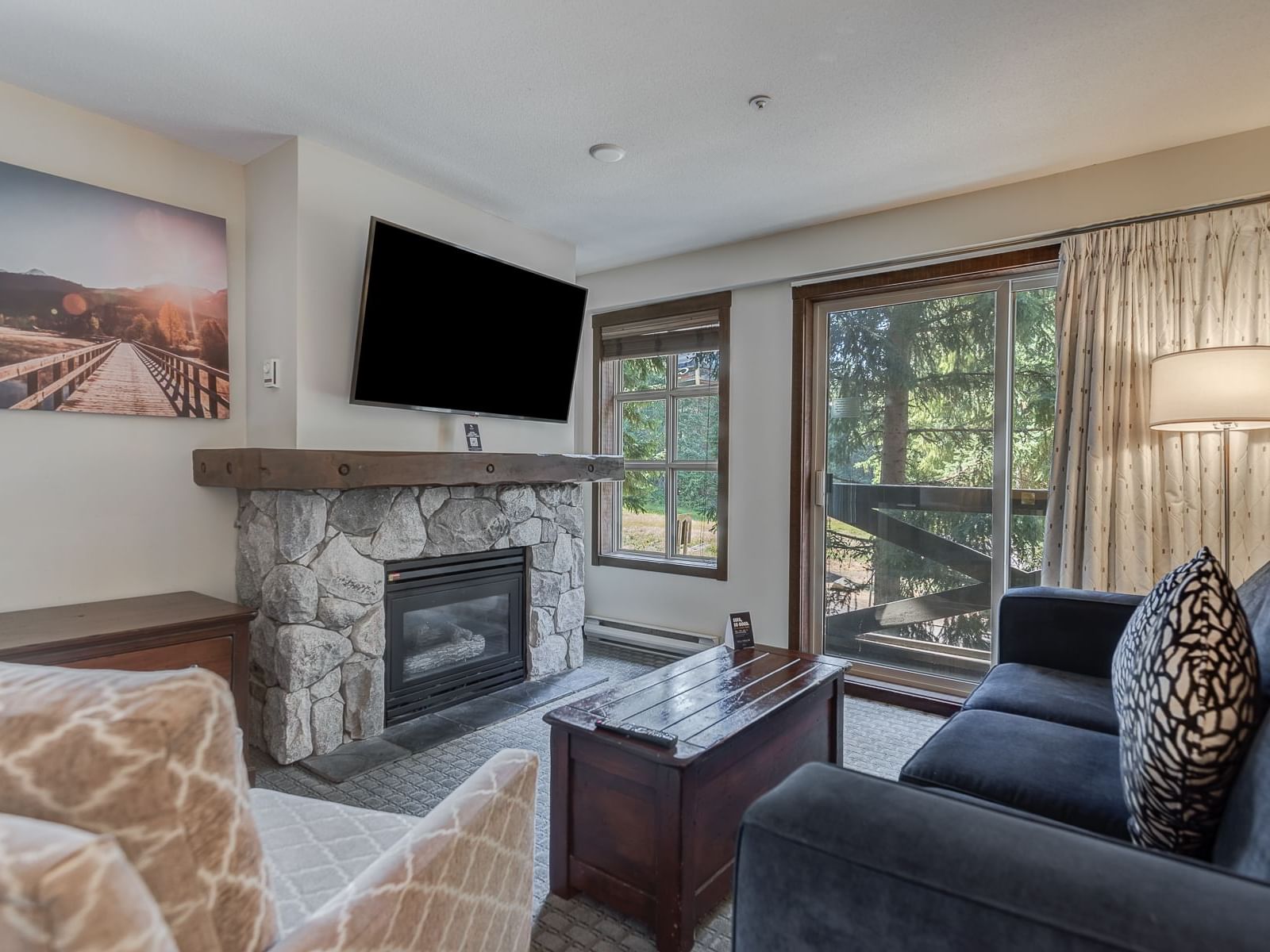 Fireplace by TV lounge area in 2 Bedroom Bunk Beds at Blackcomb Springs Suites