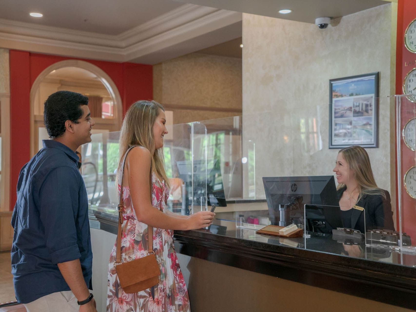 Couple checking-in by the reception at Grand Chancellor Launceston