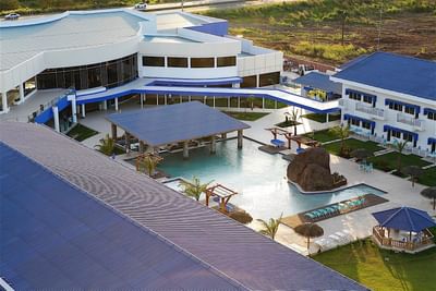 An aerial view of Hotel Mykonos showing the outdoor swimming pool and resort grounds