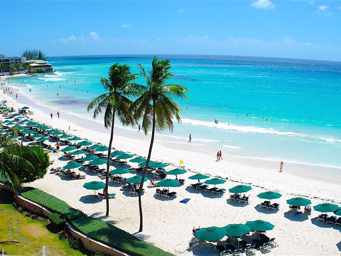 Aerial view of the beach and beach umbrellas at Accra Hotels