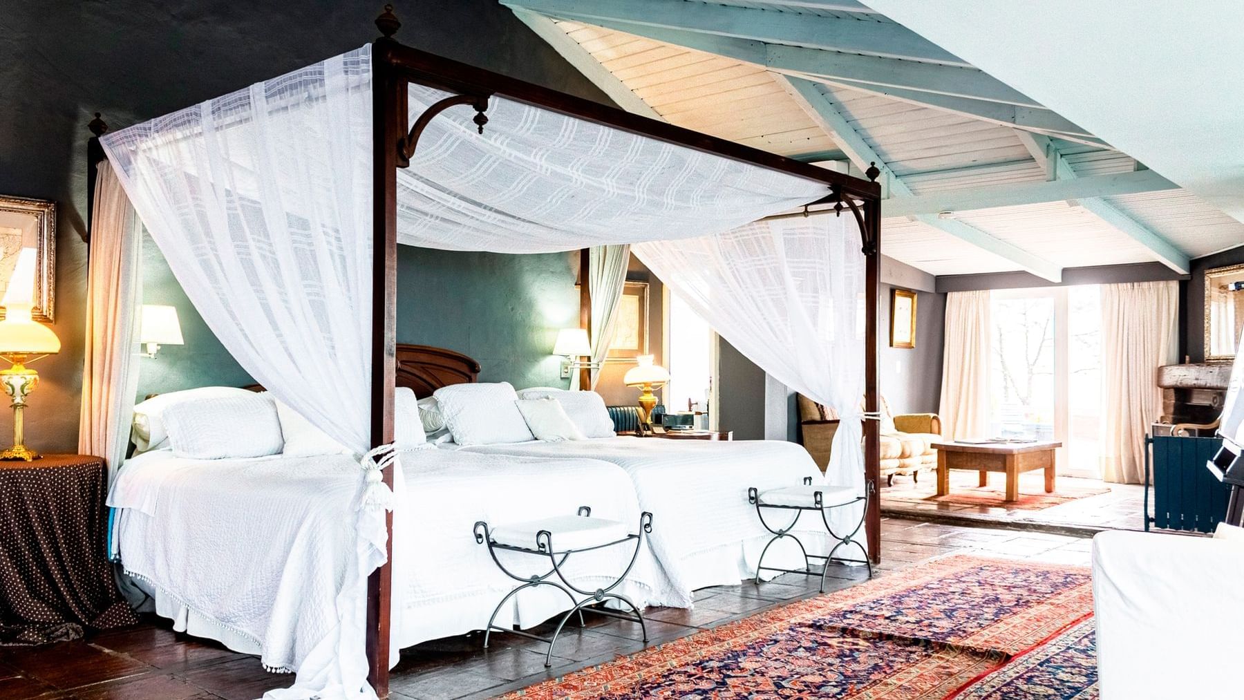 Luxurious bedroom & furniture arrangement at DOT Hotels