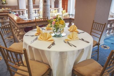 Banquet table setup for dining at MCM Elegante Beaumont