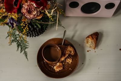 A Hot chocolate & croissant served at The Sparrow Hotel