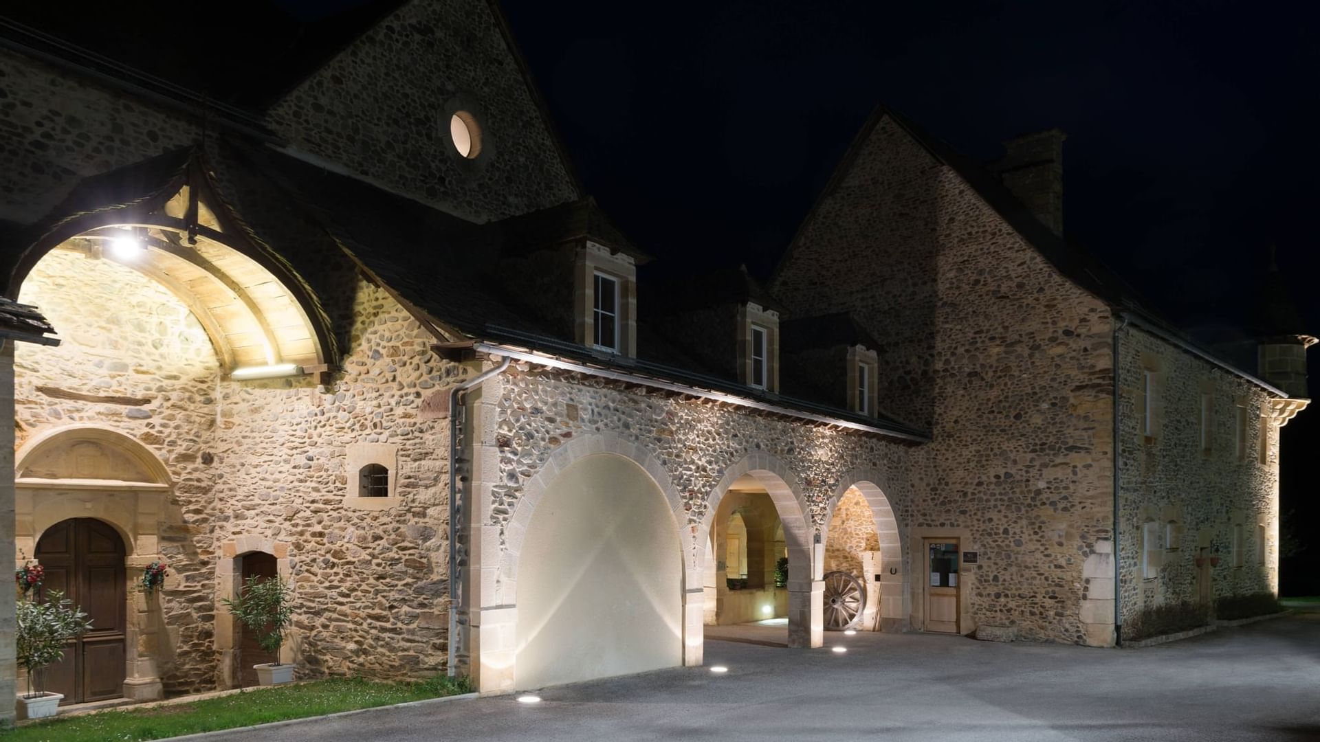 The exterior of the Chateau de la Falque at night time
