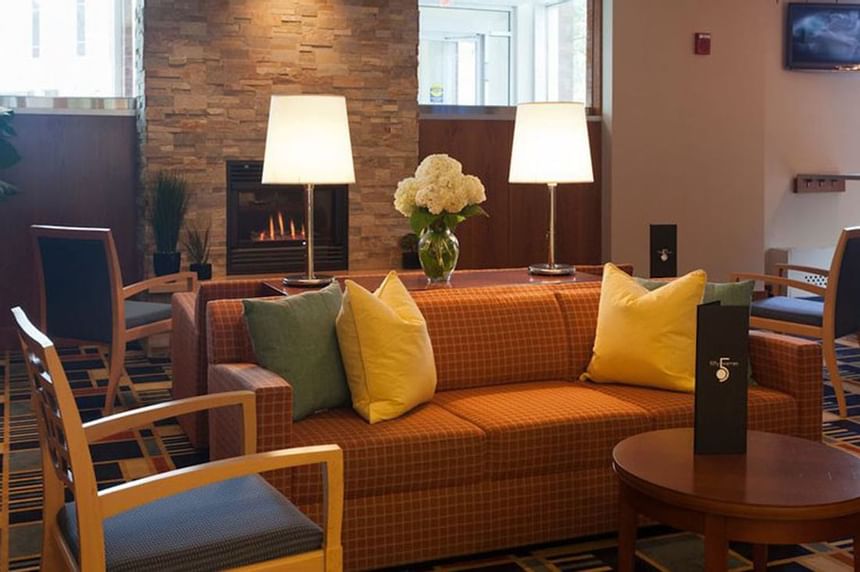 Interior of the lobby area with lounges at UMass Lowell Inn