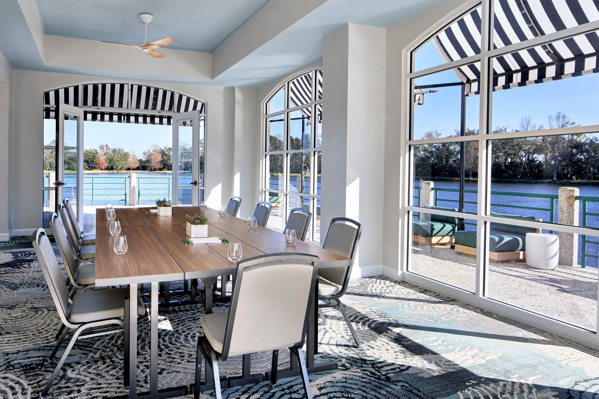 Sunlit boardroom at the Waterfront Inn at Celebration, premier meeting venues in Orlando for small professional groups