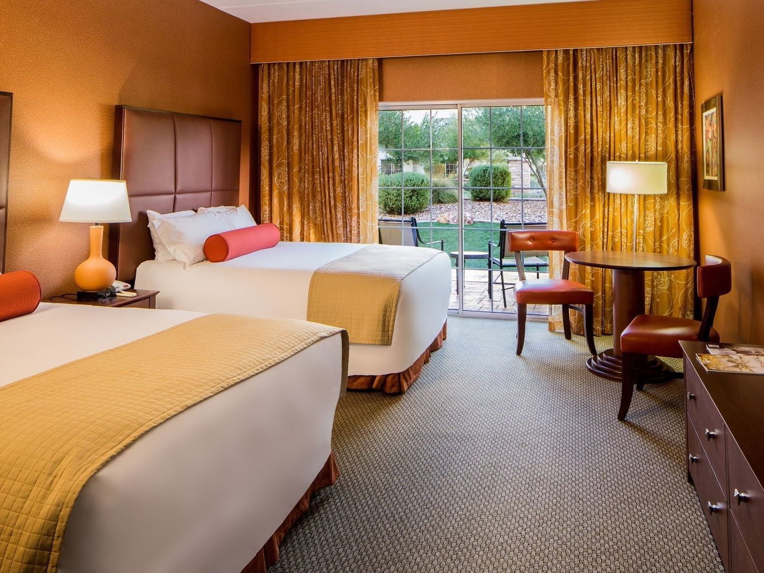 double bed room with chair and table