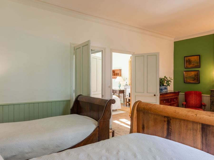 Family Suite bedroom with twin beds at The Originals Hotels