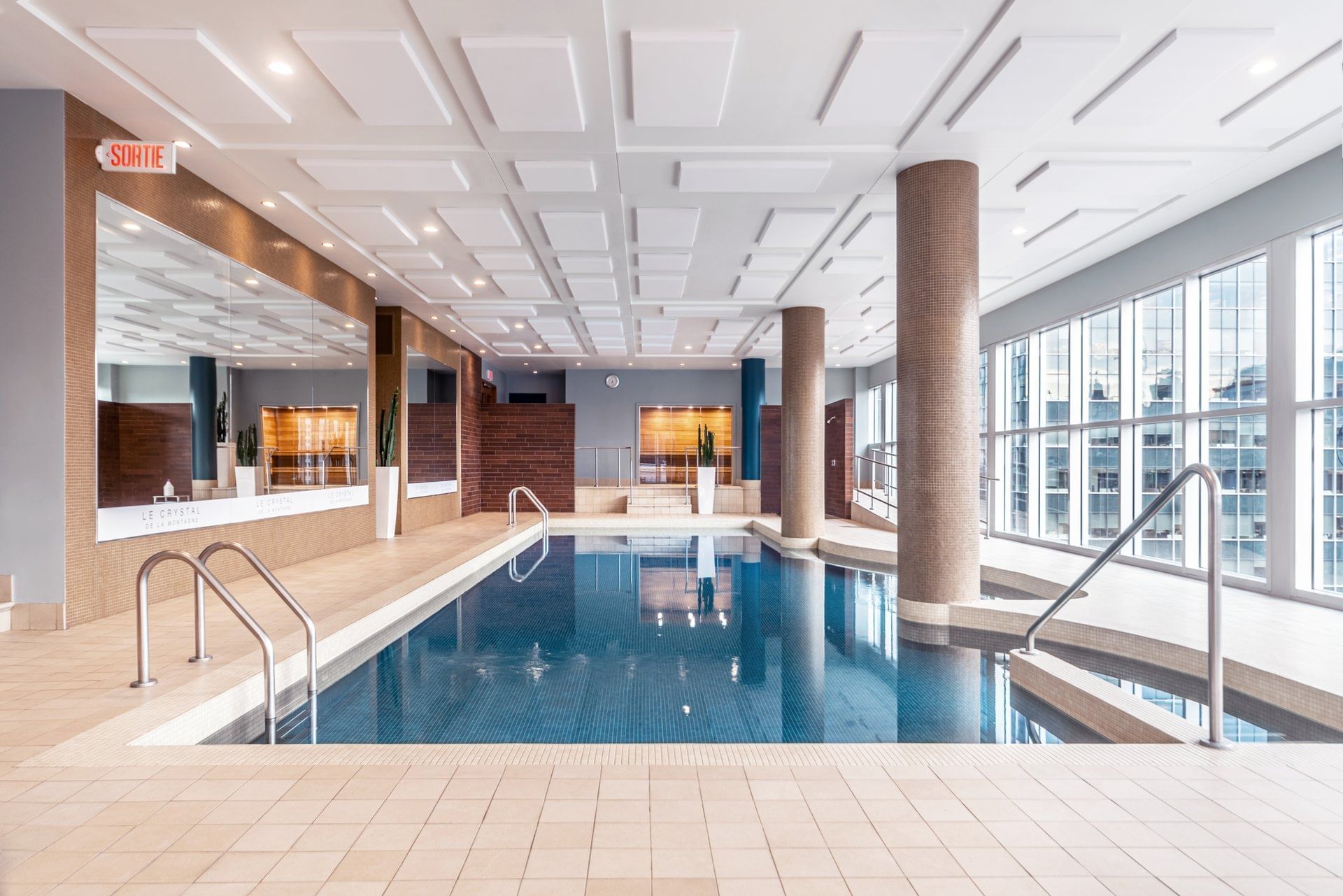 Indoor pool by the spa at Warwick Le Crystal - Montreal