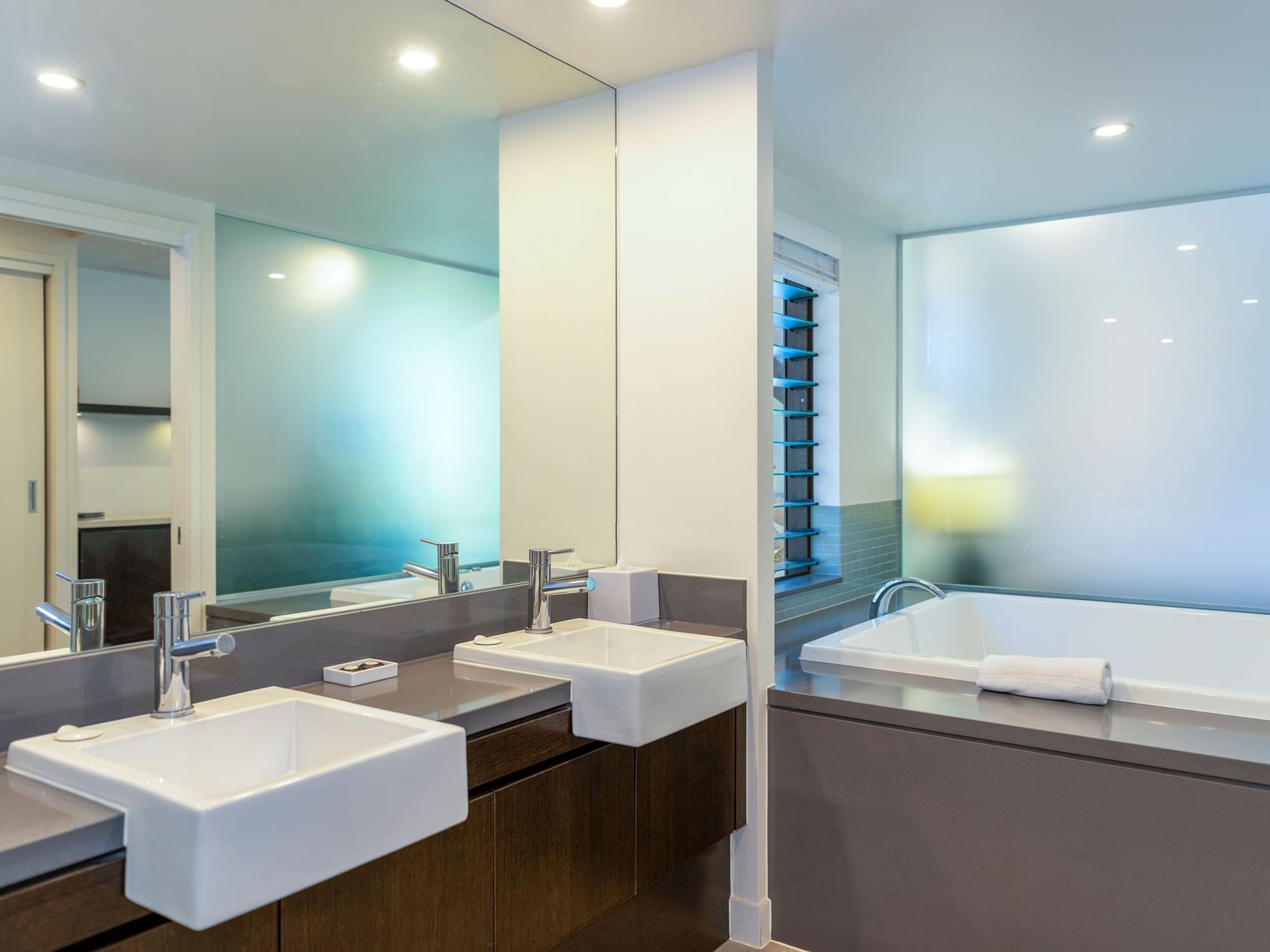 Bathroom with dual sinks, mirror & bathtub in Studio Spa Rooms at Pullman Port Douglas Sea Temple Resort & Spa