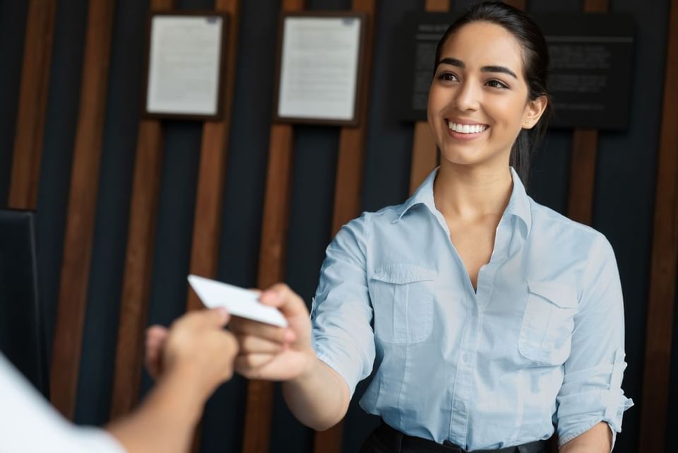 Receptionist giving details to customer at Sunseeker Resort