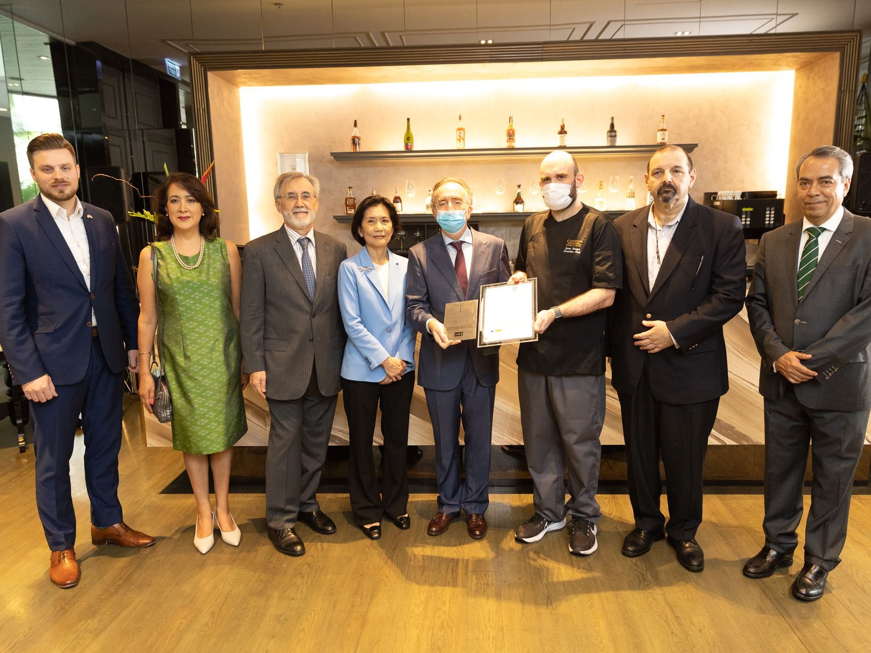 Hotel staff holding an award at Chatrium Residence Sathon