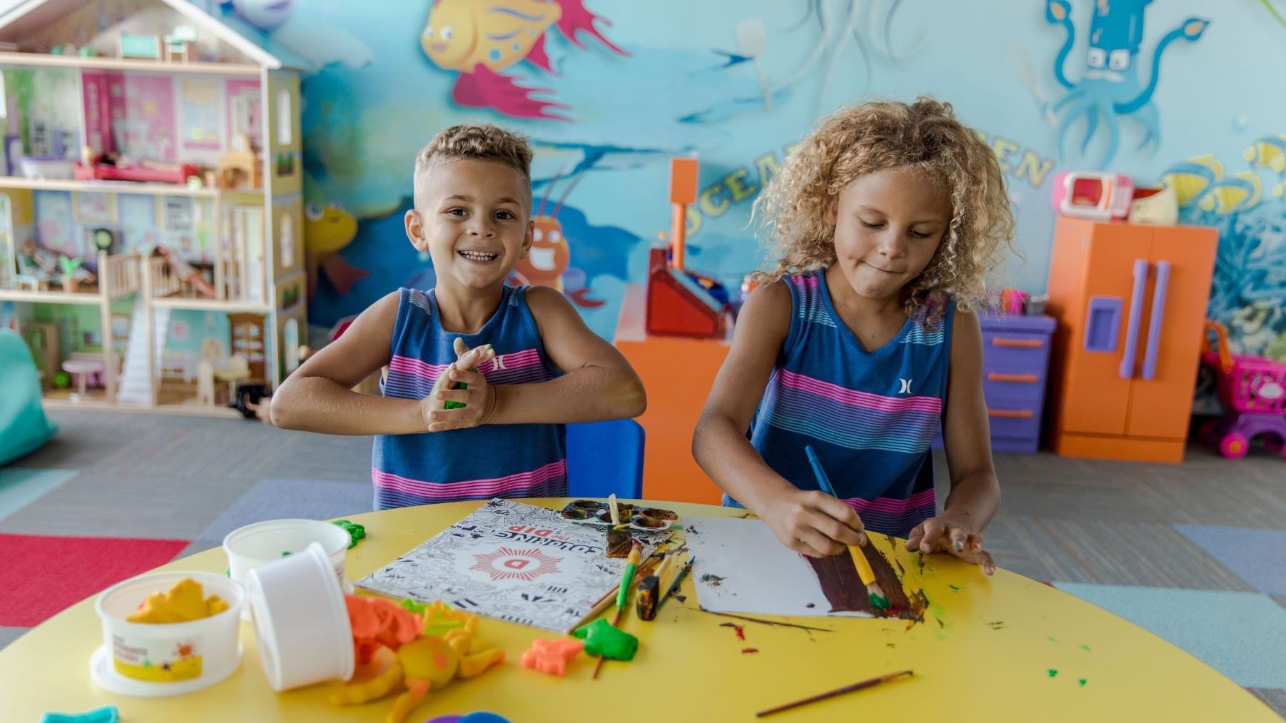 Two children with art supplies playing in Kids' Club at Diplomat Beach Resort