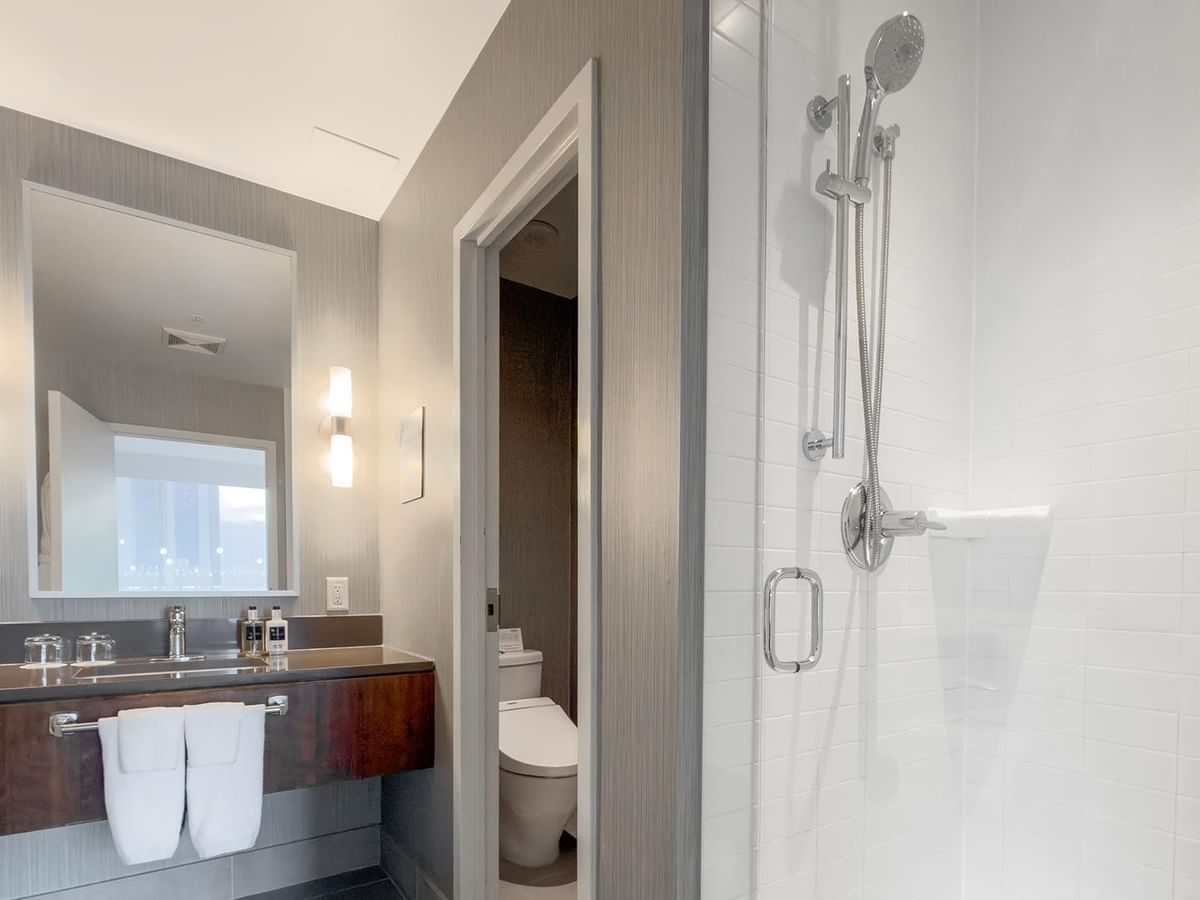 Modern bathroom with shower and sink.