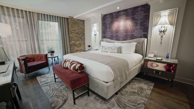 bed in cozy room with carpet