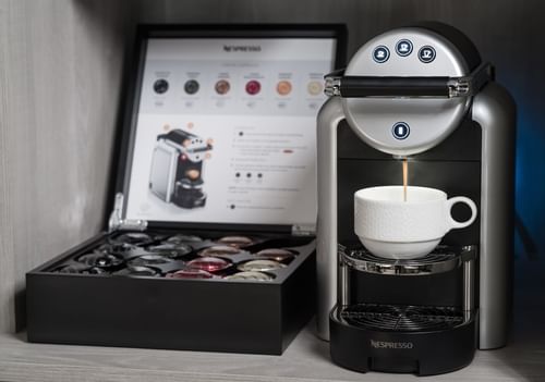 Coffee station with brewer & pods in rooms at Innovation Hotel