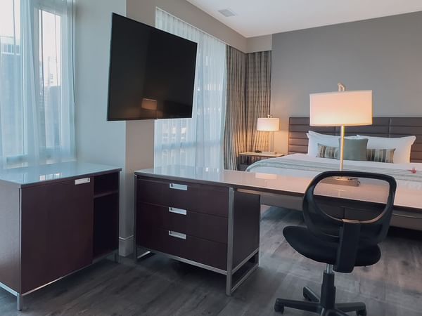 Premium King bedroom with view, table, and TV