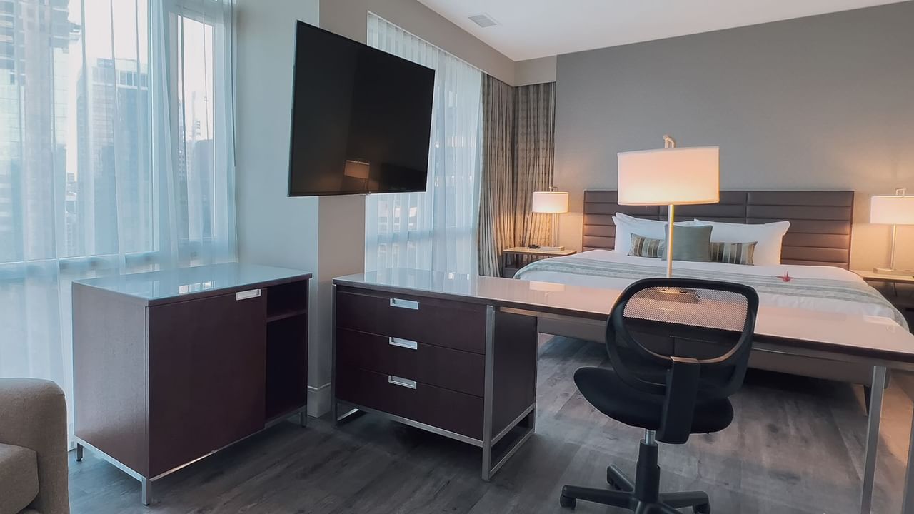 Premium King bedroom with view, table, and TV