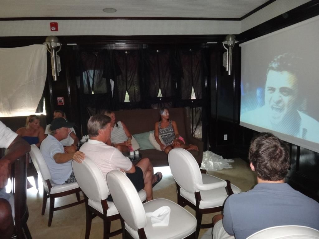 People watching & enjoying a video at The Somerset on Grace Bay