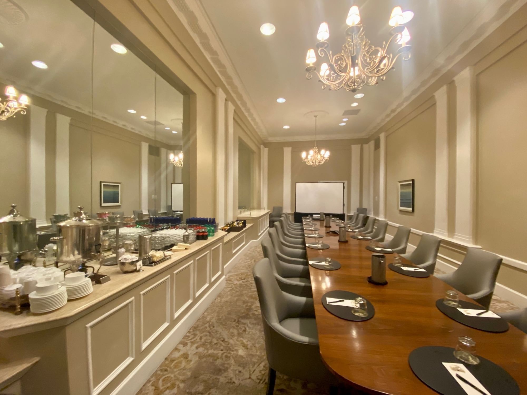 Executive Boardroom at The Peabody Memphis with catering setup and projection screen