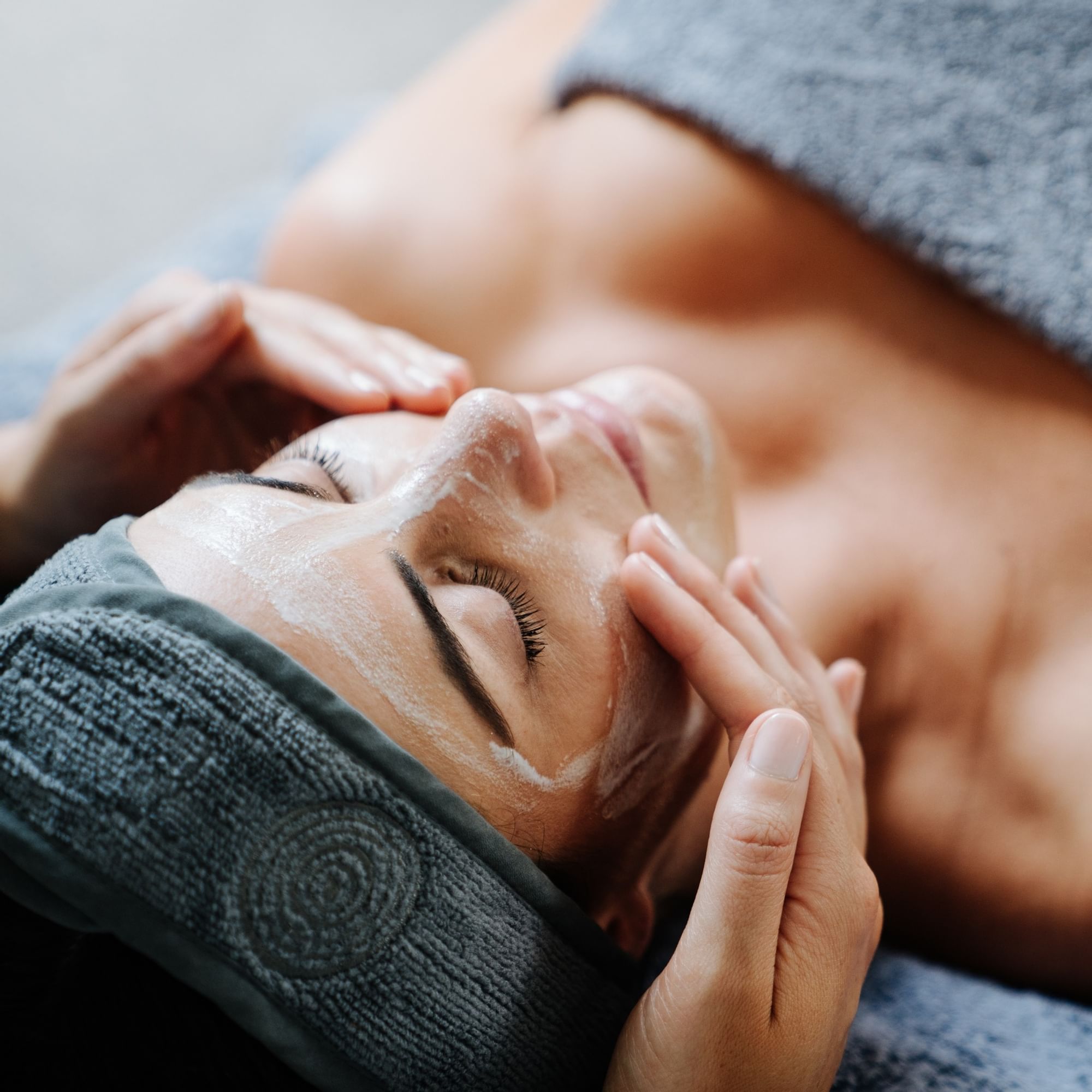 Woman in spa getting face treatment at Novotel Barossa Valley