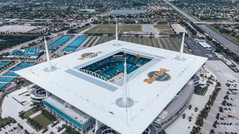 Aerial view of Hard Rock Stadium, a large sports venue near The Diplomat Resort, surrounded by urban landscape