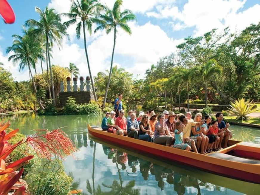 People having a boat ride in the Polynesian Cultural Center near Waikiki Resort Hotel by Sono