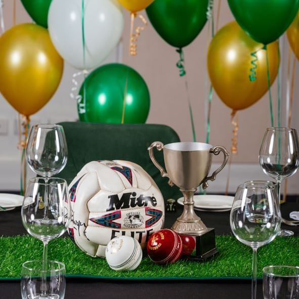 Balloons, baseball & football on a table, Novotel Glen Waverley