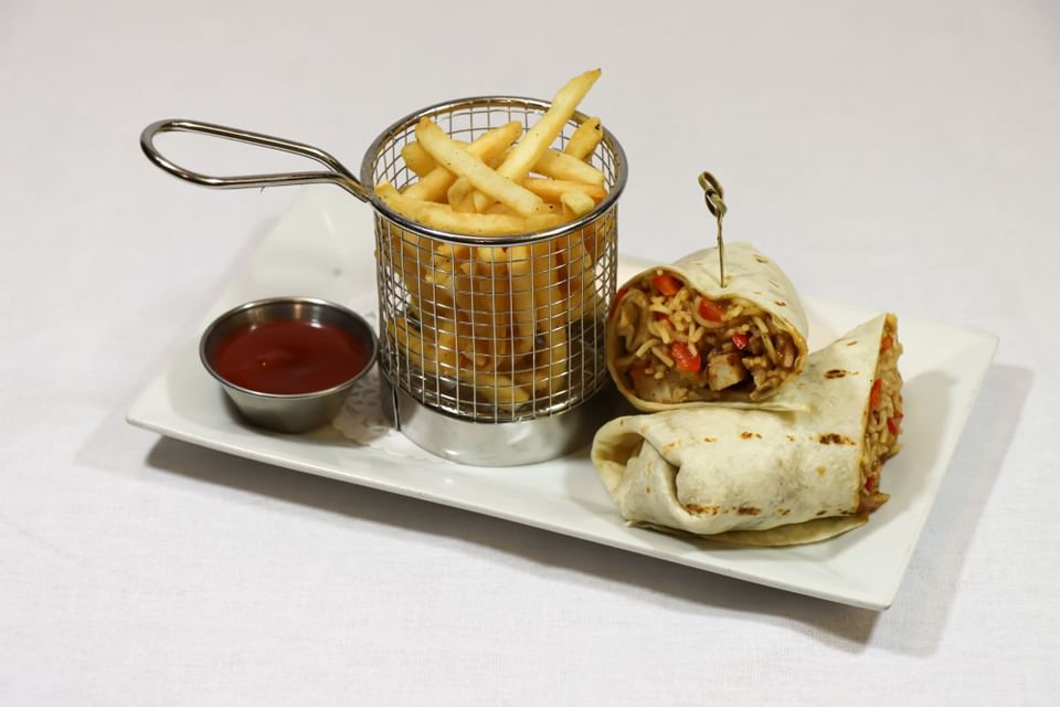 Szechwan chicken wrap served with fries at Hotel Halifax