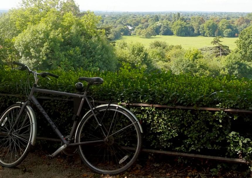 A Bicycle leaned on a fence near Richmond Hill Hotel