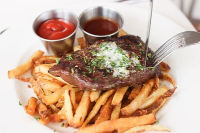 a plate of steak and fries