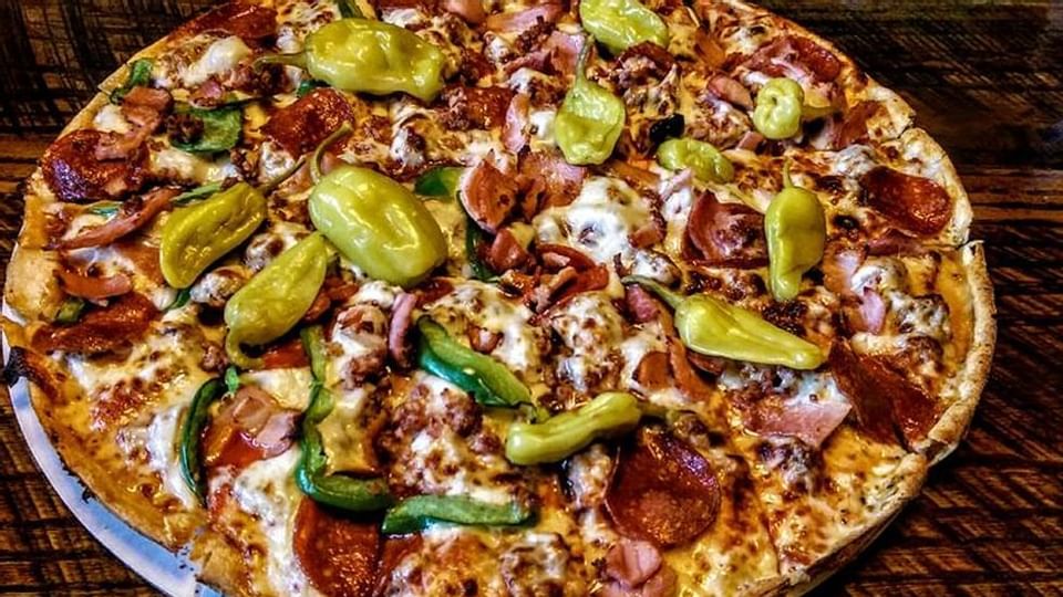 A pizza plate of Beach Pizza plus near Legacy Vacation Resorts