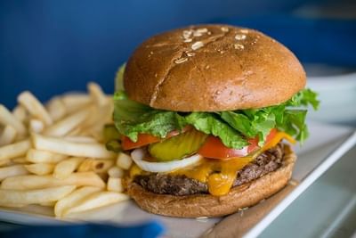Close up of juicy Burger and Fries at Bay Club Hotel