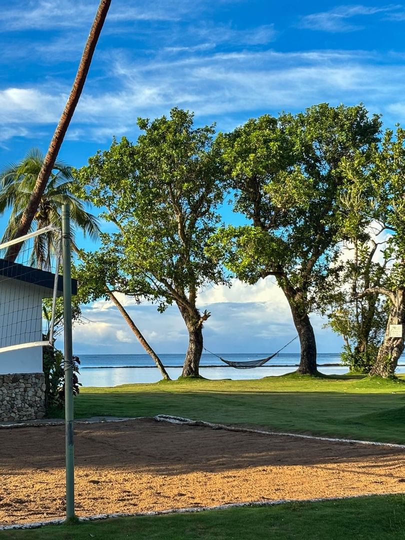 Volleyball court with scenic beach view at The Naviti Resort in Korolevu