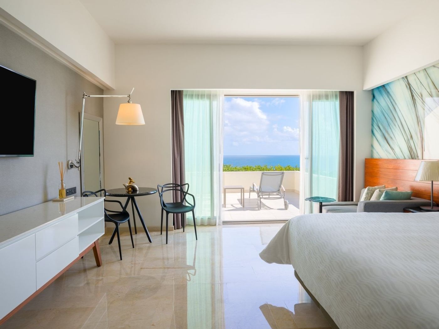 Premium Ocean Front with Terrace King bed, sitting area and TV at Live Aqua Beach Resort