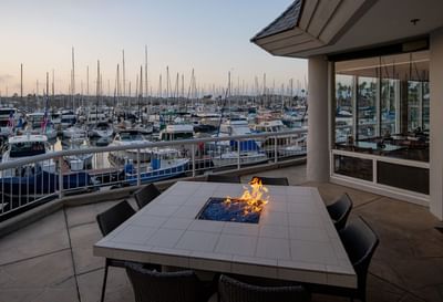 restaurant's fire table overlooking marina