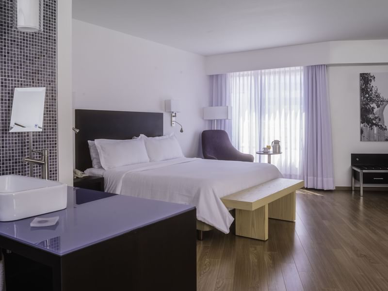 Interior of Junior Suite with king bed at Fiesta Inn