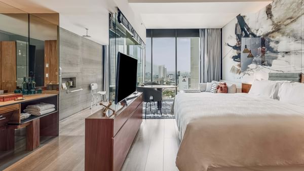 Modern interior of Accessible Room with bed and TV at FA Hotels & Resorts