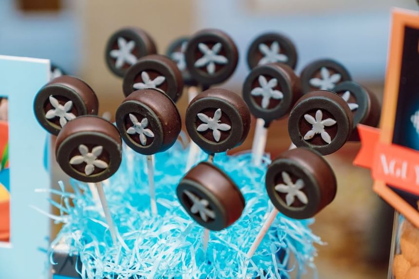 Chocolate floral lollipops arranged in a blue decorative base at Park Hyatt Saigon