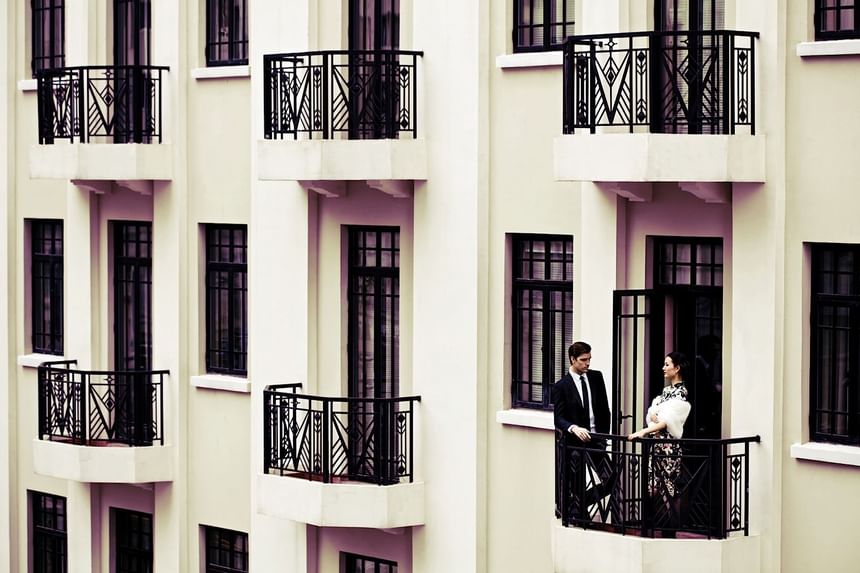 Couple standing on balcony of a room at Yangtze Boutique Hotel