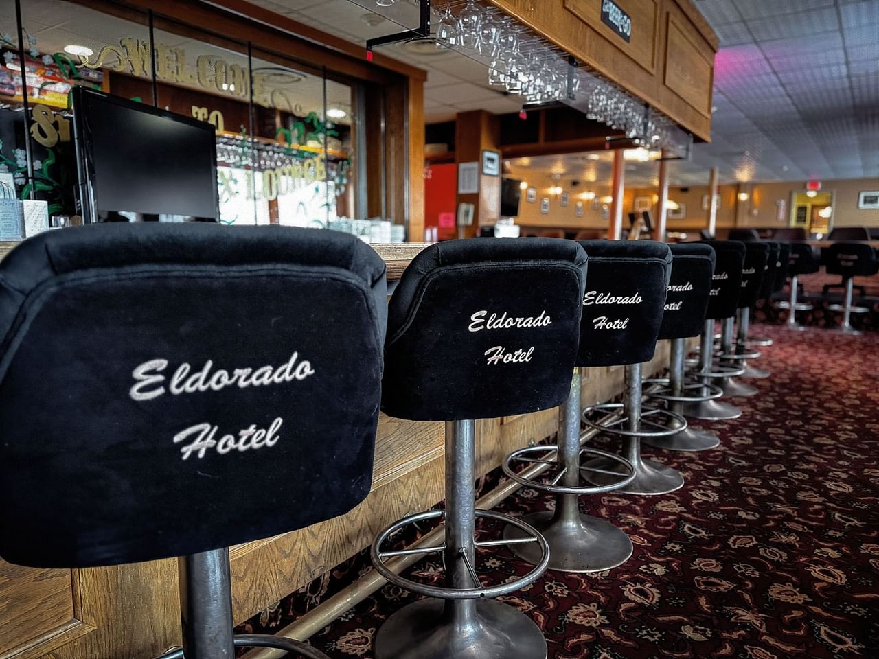 Sluice Box Lounge bar chairs with hotel name on the back