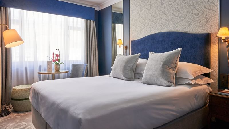 King bed with premium bedding & elegant decor in Classic Bedroom at The Capital Hotel London