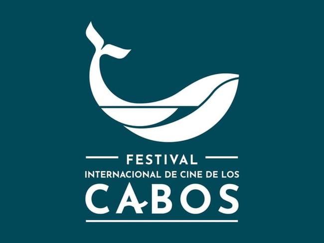 Logo del Festival Internacional de Cine de Los Cabos con silueta de ballena blanca sobre fondo azul petróleo