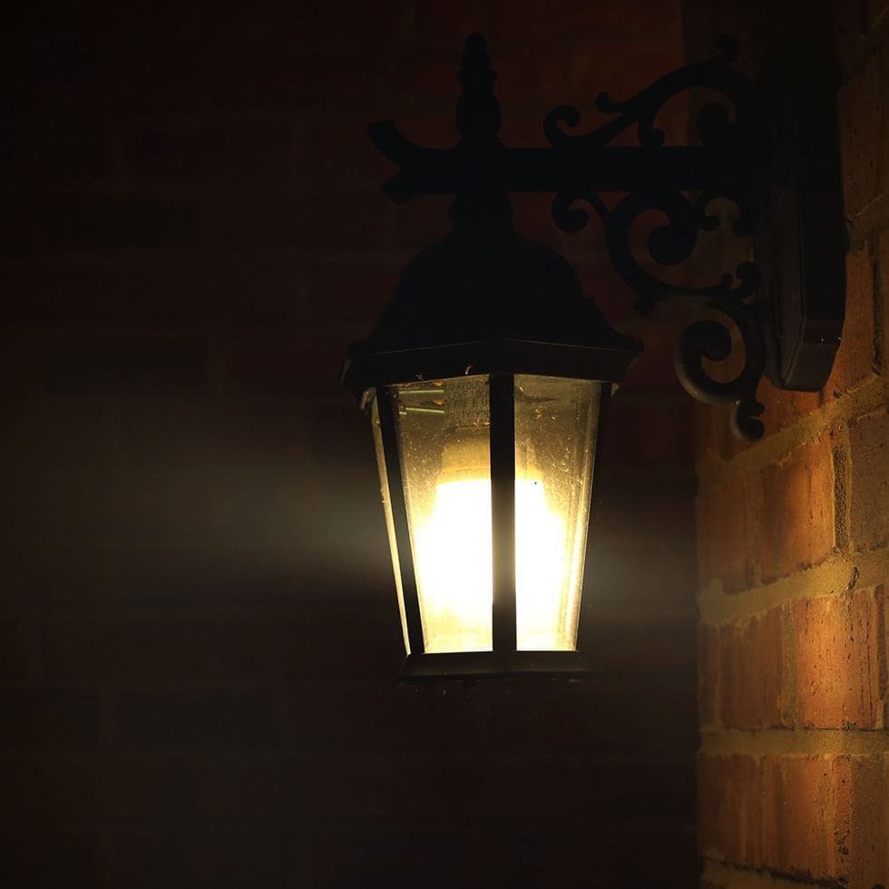 Close-up of a wall lamp at night near Falkensteiner Hotels