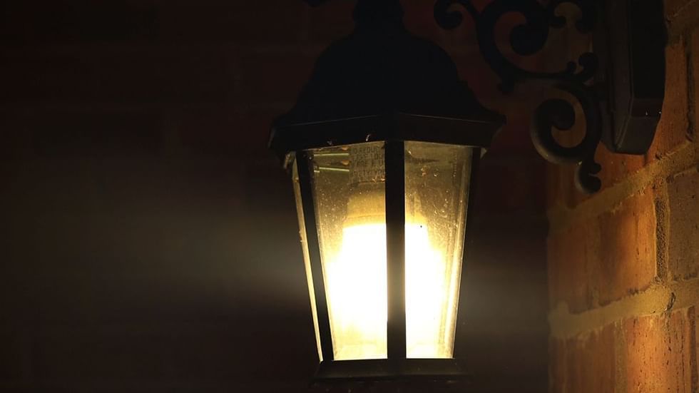Close-up of a wall lamp at night near Falkensteiner Hotels