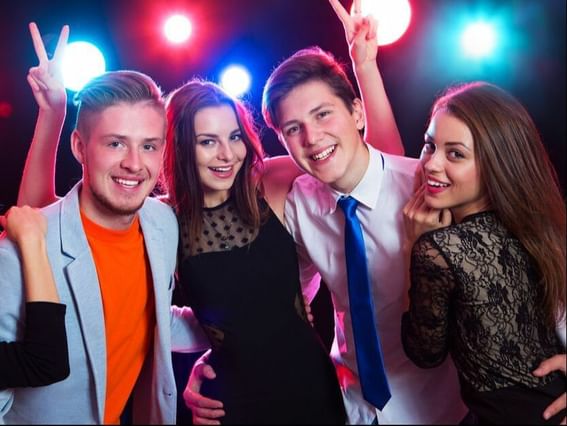 Two couples posing to the camera at Hotel Plaza San Francisco