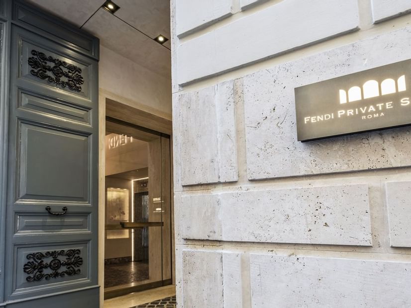 Hotel sign on the entrance wall to Fendi Private Suites