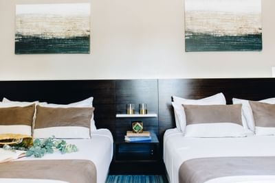 Interior of a room with twin beds at Casa Boutique Hotel