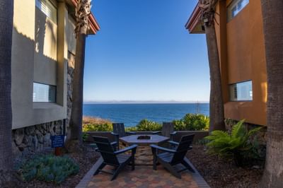 Fire pit with seating facing the ocean 